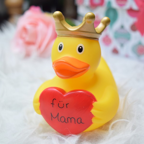 LILALU rubber duck with greeting-heart in front of presents