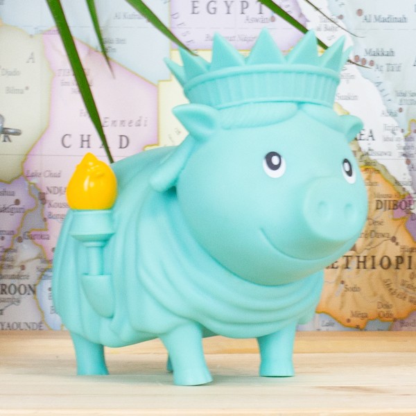LILALU BIGGYS piggy bank Freedom in front of a map